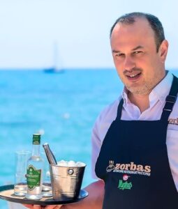Ierapetra Restaurants/A server serving Ouzo