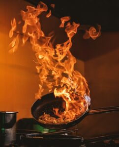 A pan with fire flambating