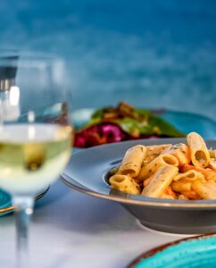 A table with at the seaside with 2 plates
